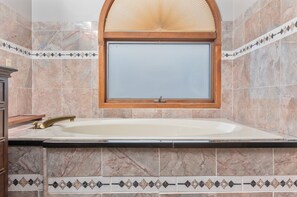 Jetted tub, hair dryer, towels, soap