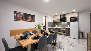 A modern kitchen with a dining area. - Villa Vinea by Villas Guide (Novakovec)