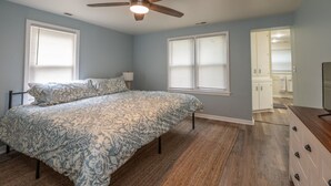 A bedroom with a bed, a ceiling fan, and a walk-in closet. - Charming 3-bedroom/2 Bath Ranch Style Home minutes to everything in Kansas City (Kansas City)