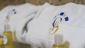 Shower, towels, soap, toilet paper