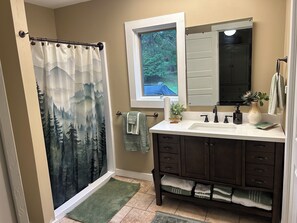 Shower, hair dryer, towels, soap