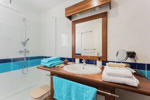 Shower, hair dryer, towels, soap