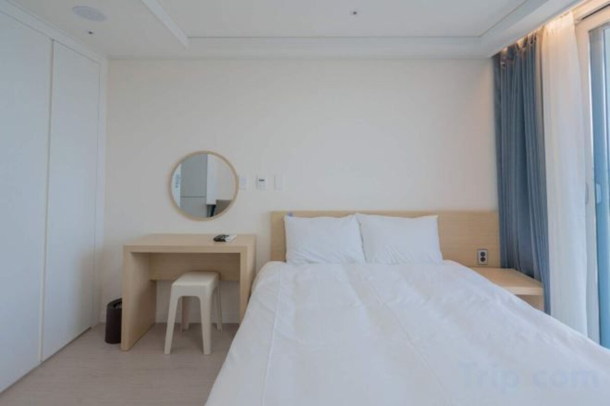 Premium bedding, desk, laptop workspace, free WiFi