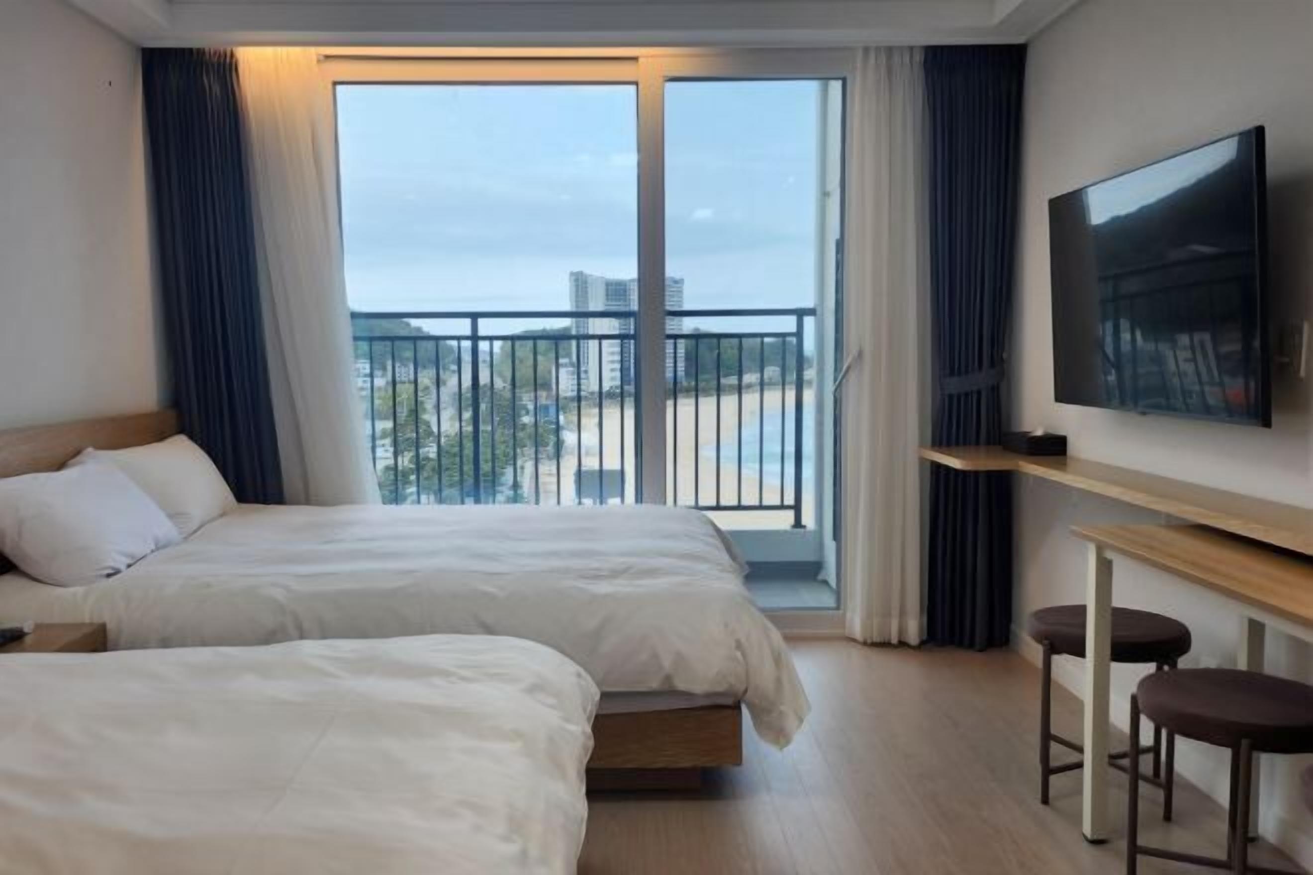 Premium bedding, desk, laptop workspace, free WiFi