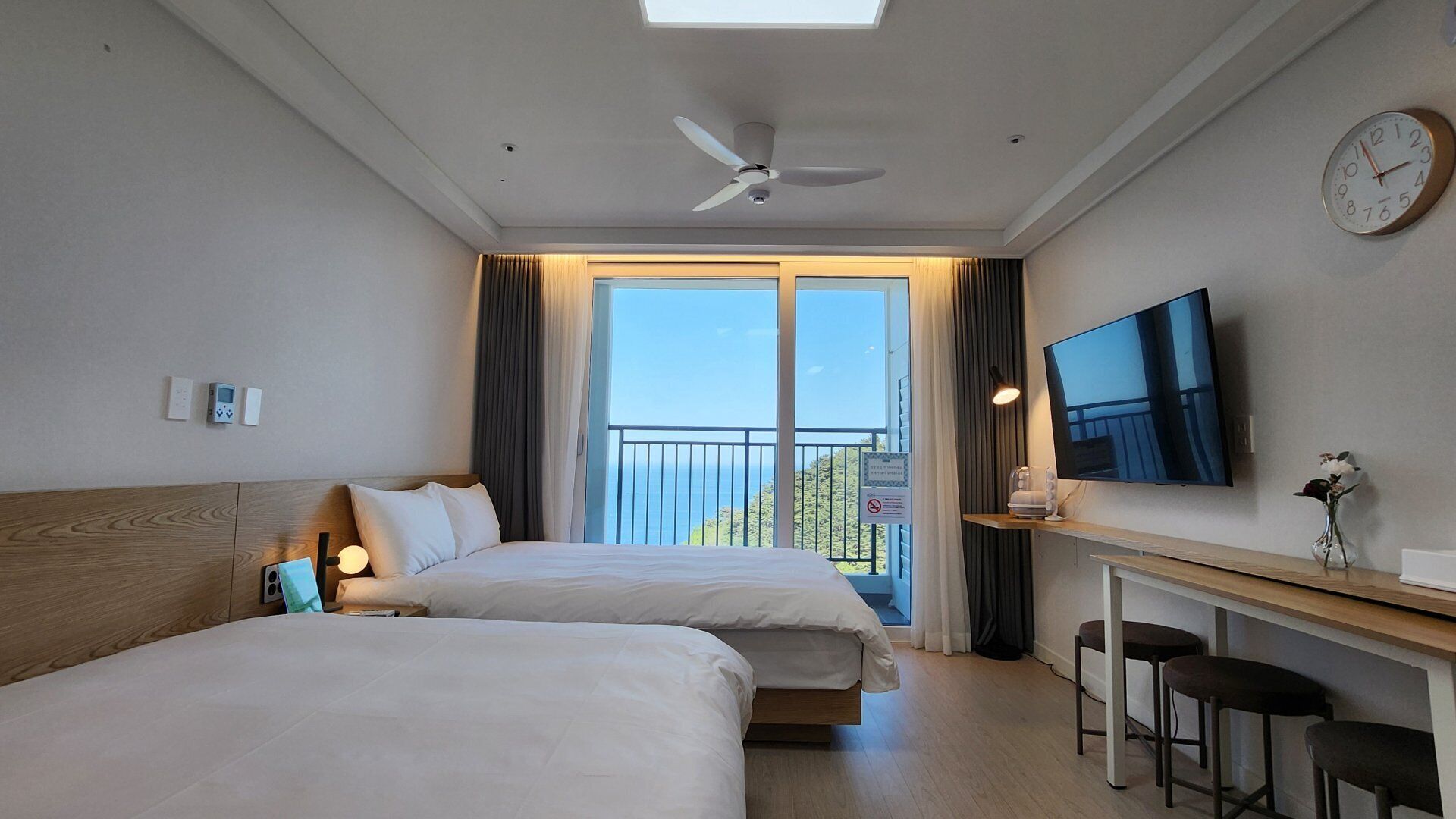 Premium bedding, desk, laptop workspace, free WiFi