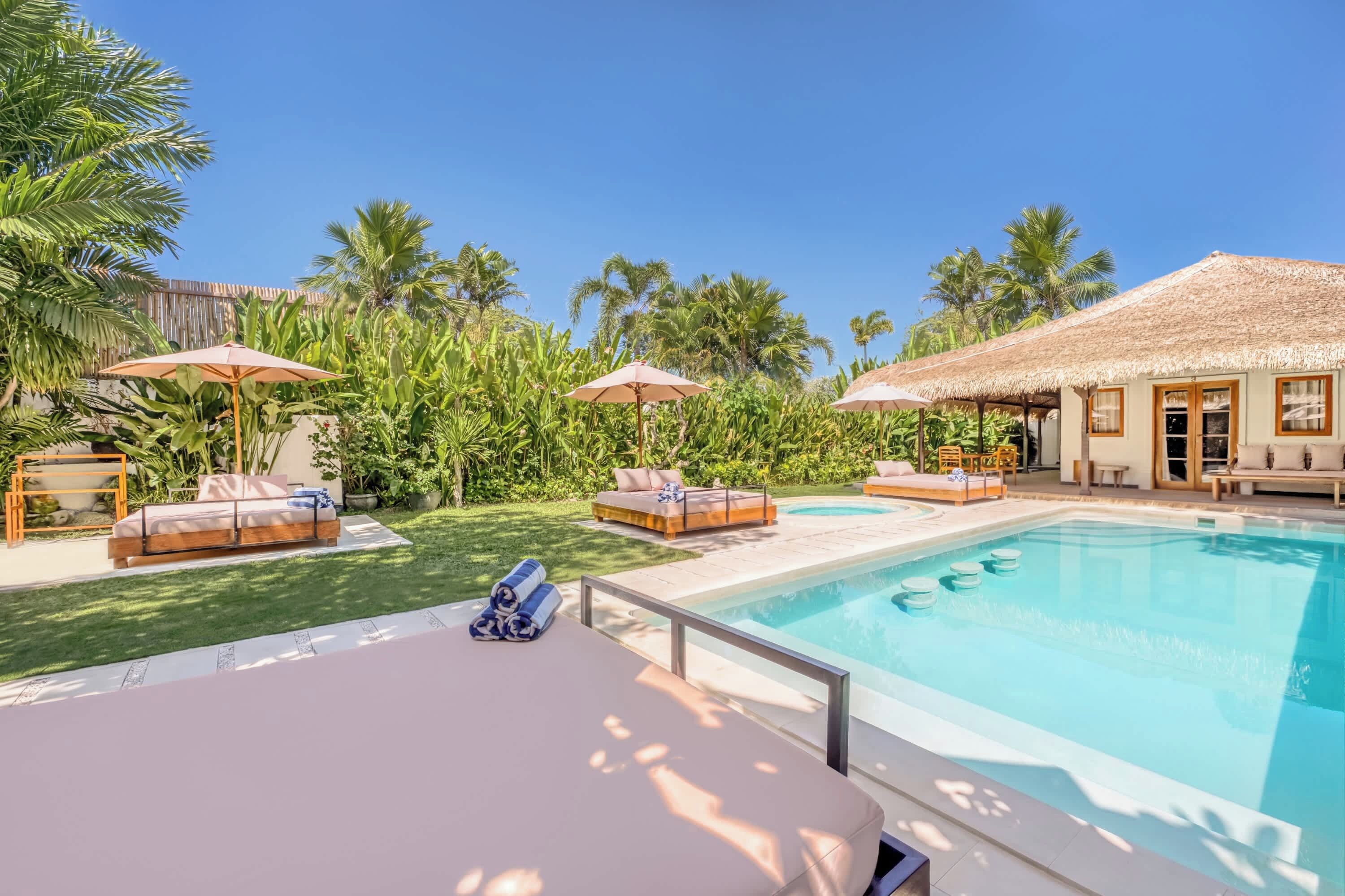 Turquoise water surrounded by palms creating a peaceful escape for slow vacation days