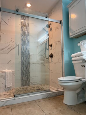 Shower, hair dryer, towels, soap