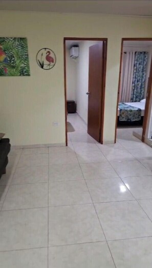 Family Apartment, Balcony | Living area | 32-inch flat-screen TV with cable channels