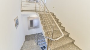 A staircase with metal railings and granite steps. - Beachfront apartment Liverić 4 (Vir)