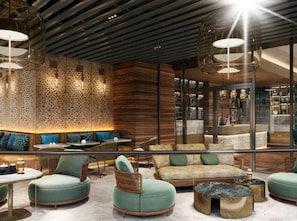Un espace de détente moderne comprenant des sièges, une table basse et un mur décoratif.