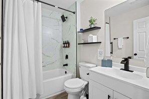 Shower, hair dryer, towels, shampoo