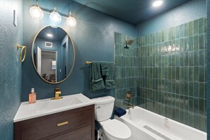 Shower, towels, soap, toilet paper