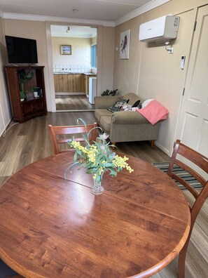 Family Apartment | Living area | 30-cm flat-screen TV with satellite channels