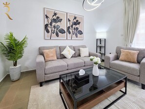 TV - Stylish 1BR with Dining, Balcony & Kitchen Al Reef (Abu Dhabi)