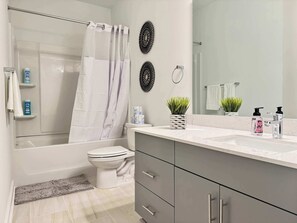 Shower, hair dryer, towels, shampoo