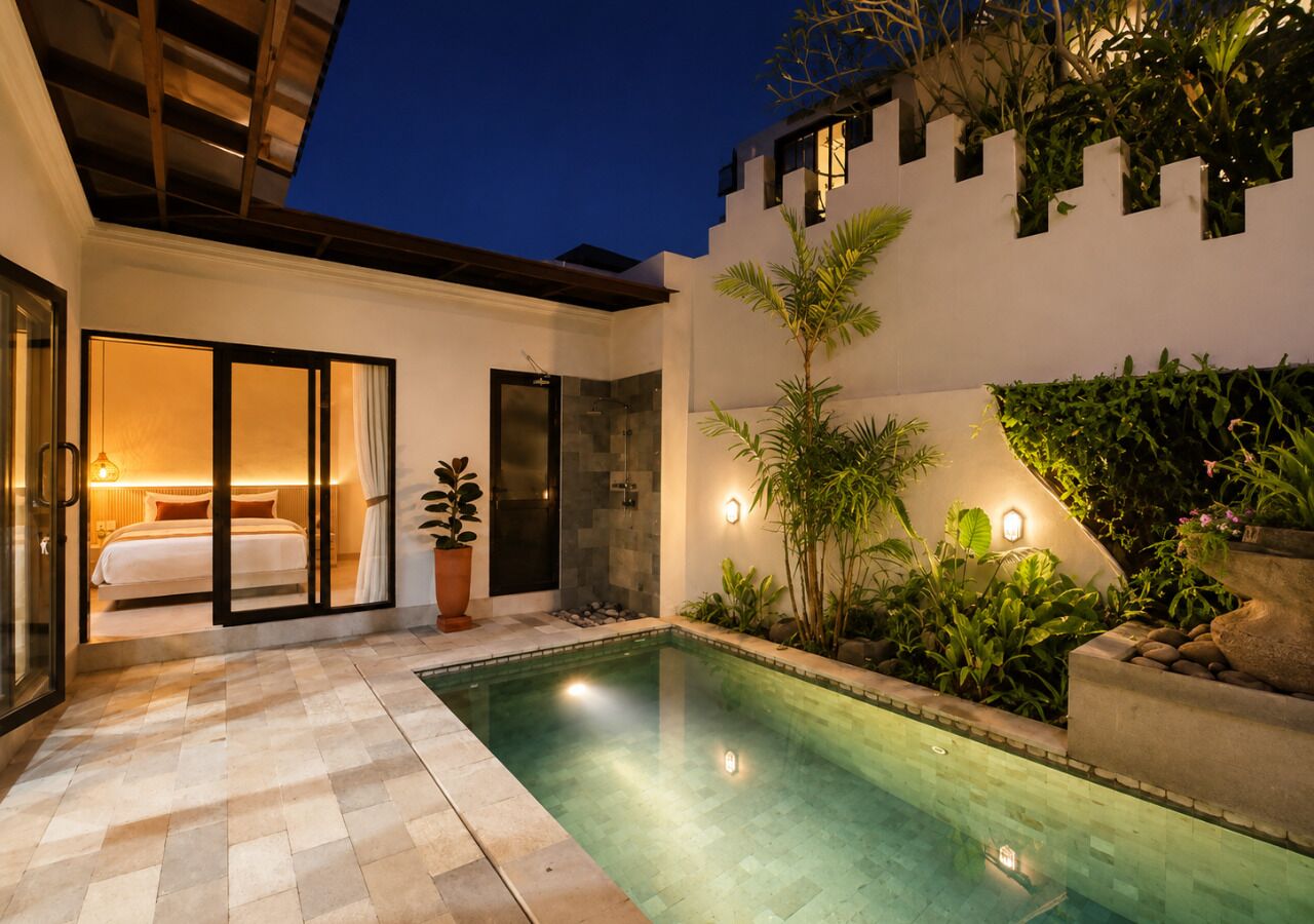 A modern outdoor pool area with a glass-enclosed bedroom and a well-lit garden.