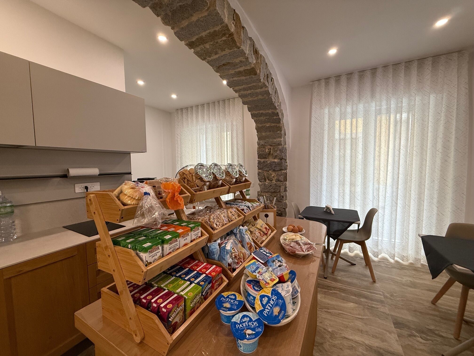 A breakfast bar with various food items and dairy products.