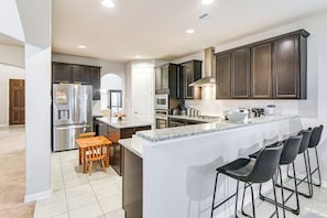 Fridge, microwave, stovetop, dishwasher - Grand Family Home w/ Patio & Fenced Yard in Arcola (Arcola)