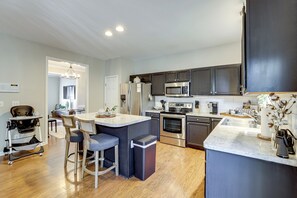 Fridge, stovetop, dishwasher, coffee/tea maker