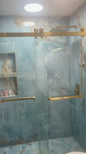 Shower, hair dryer, towels, soap