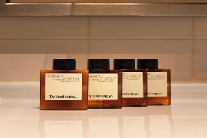 Shower, hair dryer, towels, shampoo