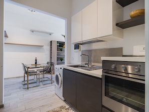 Fridge, oven, cookware/dishes/utensils