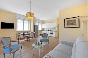 Family Apartment, Multiple Bedrooms (Strixia Apartment Stresa 50m From) | Living area | 21-inch flat-screen TV with cable channels