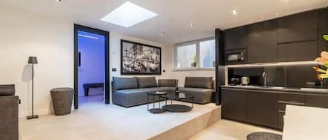 Apartment, 1 Bedroom | Living area | 40-inch flat-screen TV with digital channels