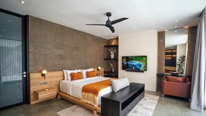 A modern bedroom with a bed, bedside tables, a TV, and a ceiling fan. - VILLA NANDI (Kerobokan)