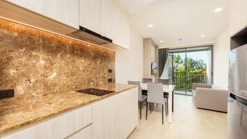 Apartemen, balkon, pemandangan kebun | Area keluarga