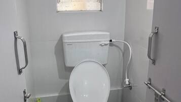 Bidet, towels, soap, toilet paper