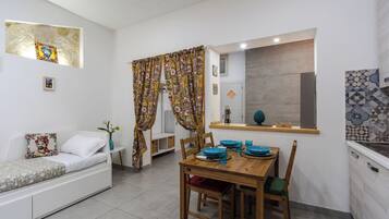 Apartment, 1 Bedroom | Living area | 30-inch TV with satellite channels