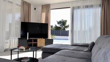 Villa (Four Bedroom Villa) | Living room | 32-inch flat-screen TV with satellite channels