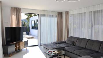 Villa (Four Bedroom Villa) | Living room | 32-inch flat-screen TV with satellite channels