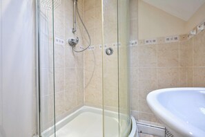 Shower, hair dryer, towels, shampoo