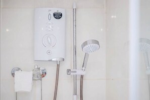 Shower, hair dryer, towels, shampoo