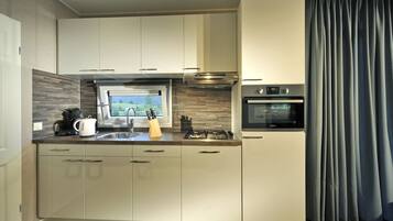 Classic Mobile Home, 2 Bedrooms | Private kitchen | Fridge, microwave, dishwasher, coffee/tea maker