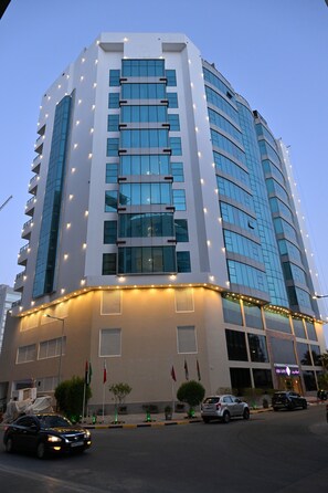 A multi-story building with a curved facade, large windows, and a flat roof. - Savoy Grande Hotel and Spa (Manama)