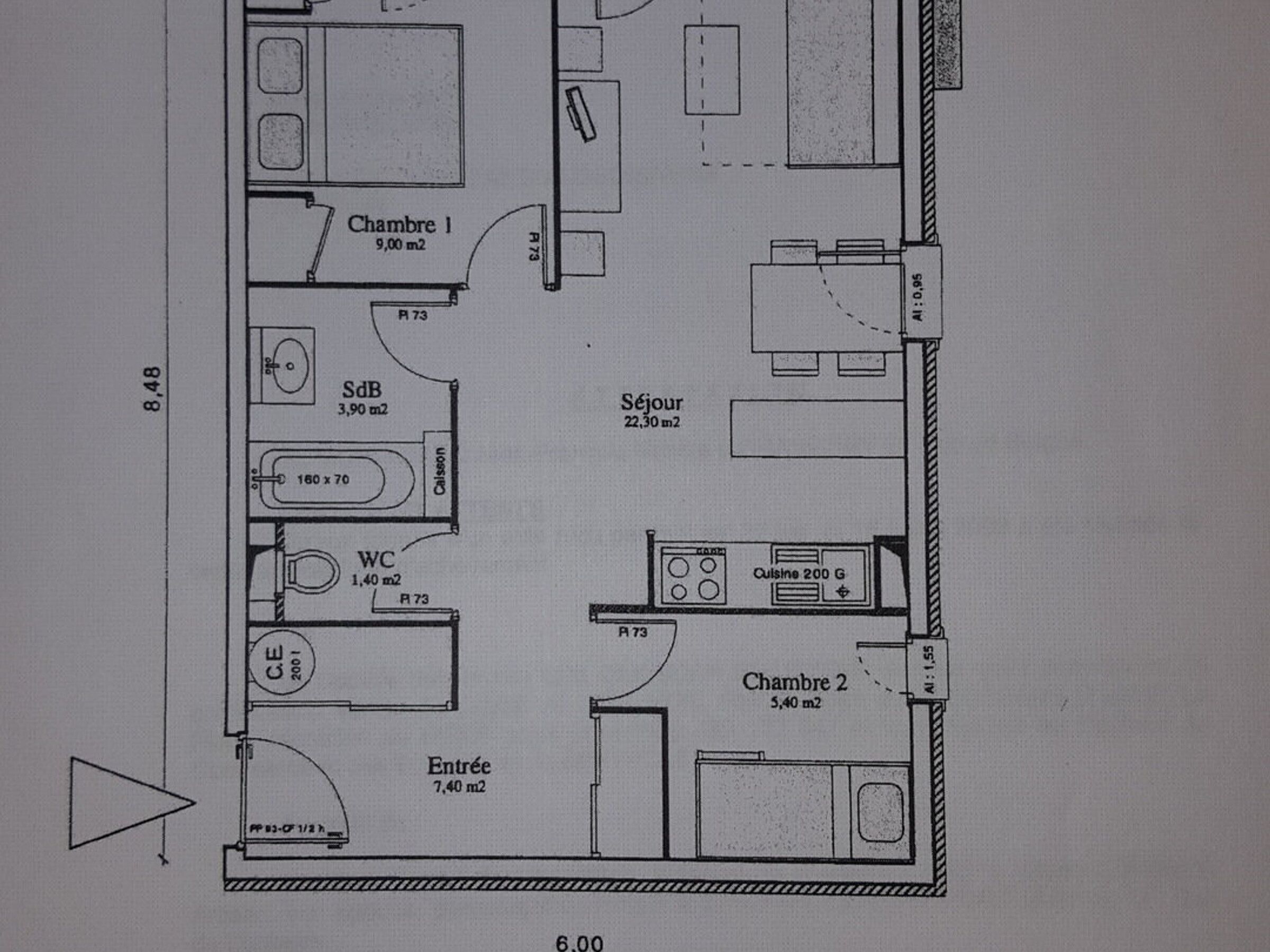 A floor plan with two bedrooms, a bathroom, a kitchen, and a living area.