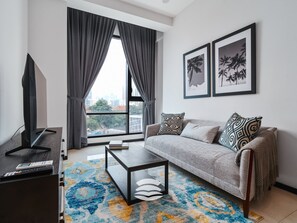 スーペリア アパートメント 1 ベッドルーム バルコニー シティビュー | リビング エリア