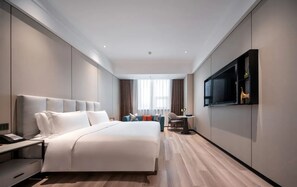 Deluxe King Room | Down comforters, desk, laptop workspace, blackout drapes