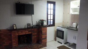 Basic Chalet, Garden View | Living area | TV