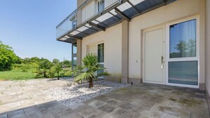 A modern building with a balcony, a door, and a window. - Appia (Mestre)