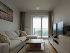 Apartamento, balcón | Zona de estar