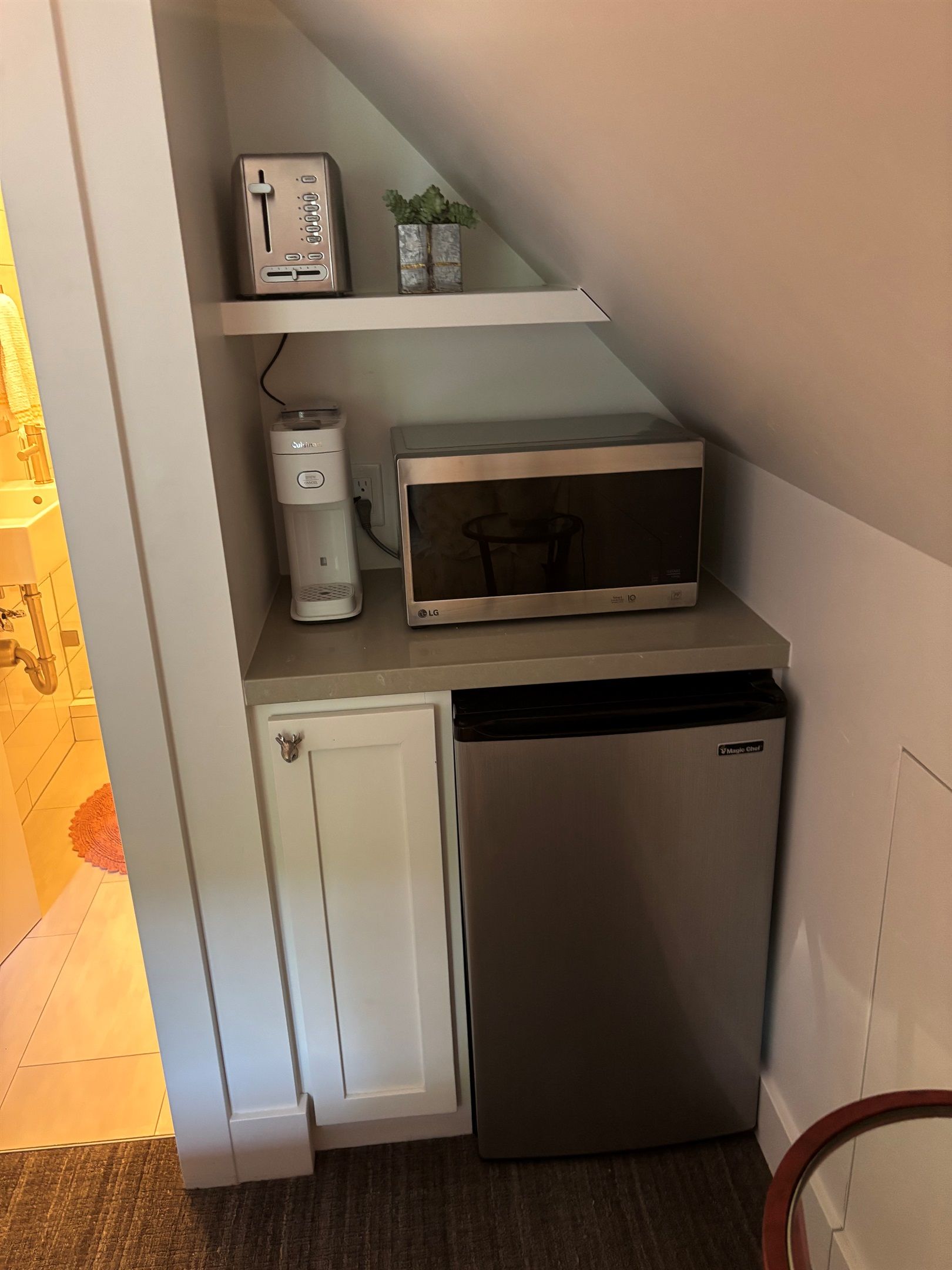 Kitchenette with a microwave, mini fridge, and coffee maker