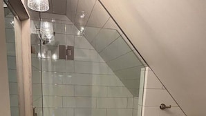 A modern bathroom with a glass-enclosed shower, a sink, and a toilet. - Chic Mountain Loft • Breathtaking Views (Provo Canyon)