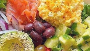 A salad bowl with various vegetables and proteins. - Star of Africa Hotel (Abuja)