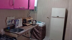 Fridge, electric kettle, toaster, cookware/dishes/utensils