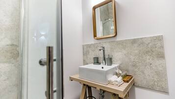 Shower, towels, soap, toilet paper