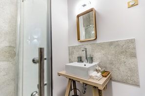 Shower, towels, soap, toilet paper